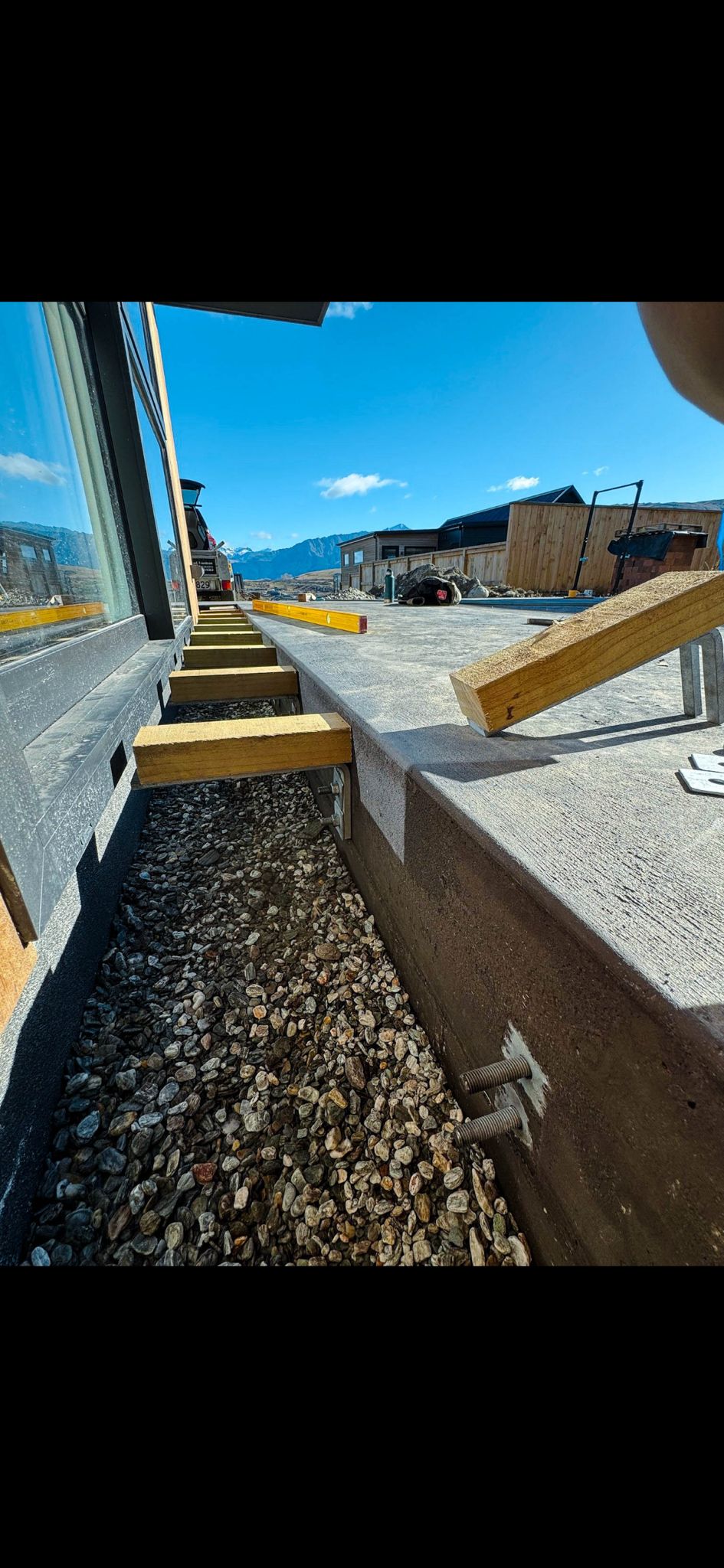 Side view of deck entry installation showing timber subframe