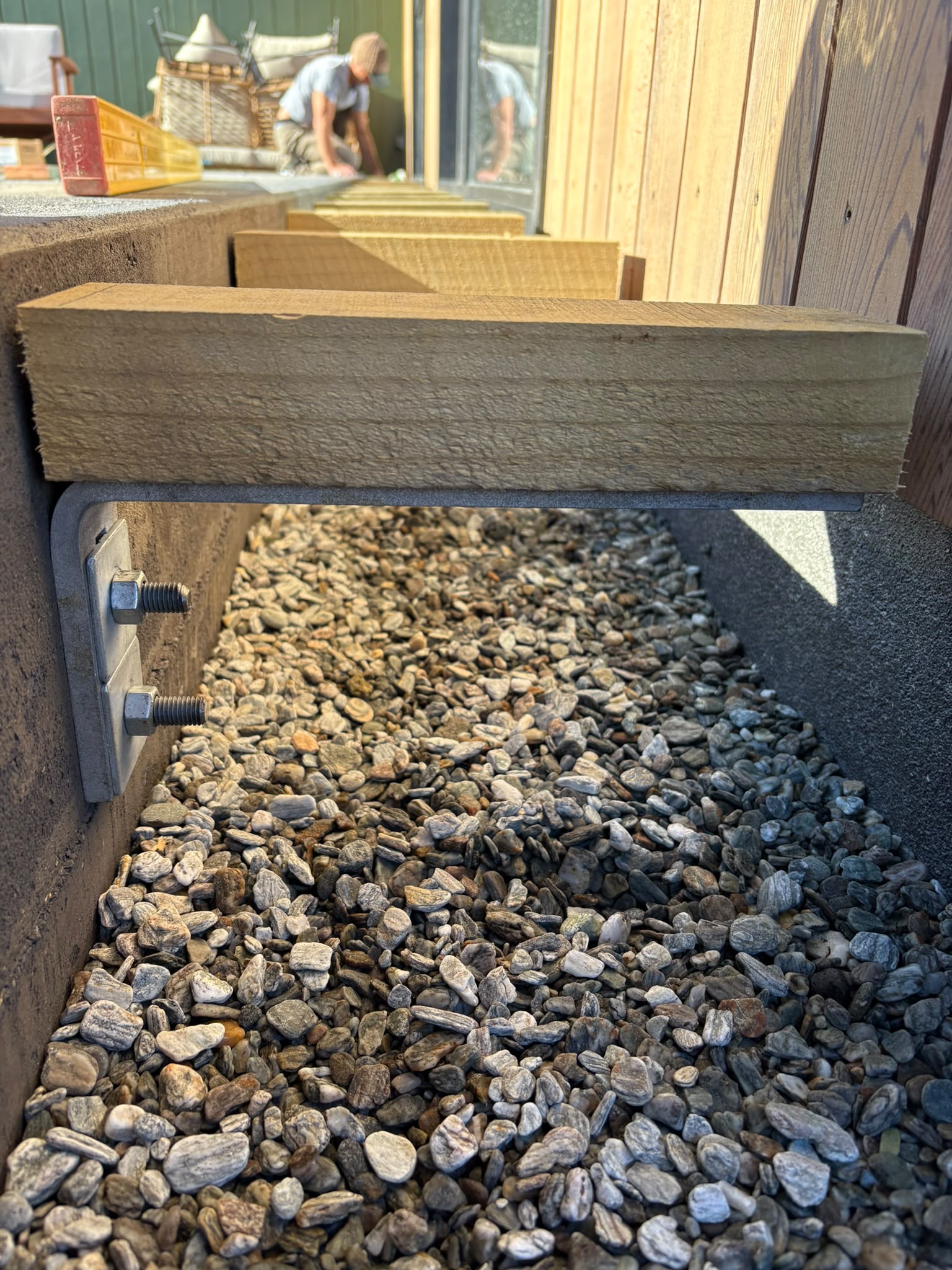 Even Entry bracket with timber packer installed on concrete slab edge
